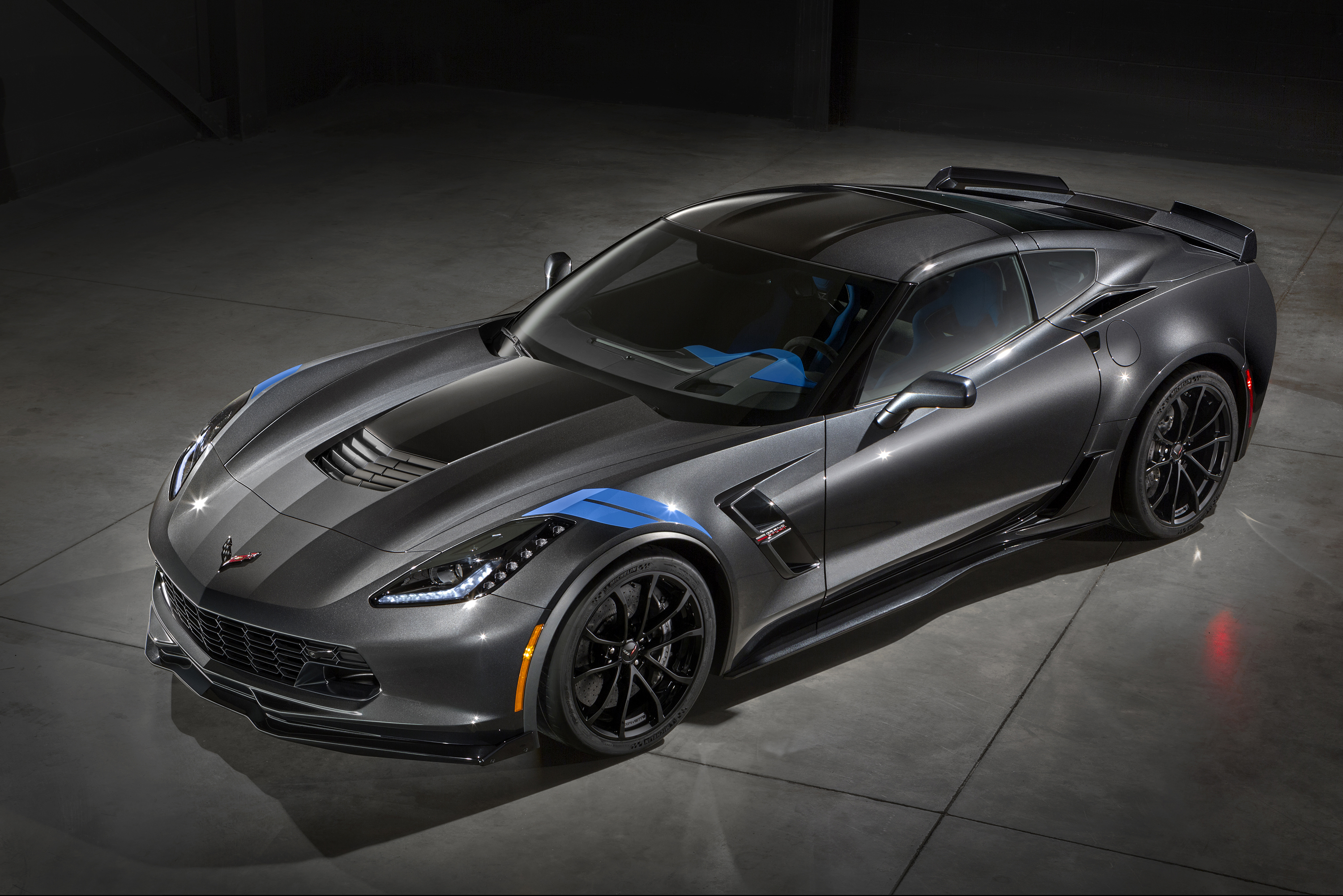 The new 2017 Chevrolet Corvette Grand Sport combines a lightweight architecture, a track-honed aerodynamics package, Michelin tires and a naturally aspirated engine to deliver exceptional performance. The Grand Sport Collector Edition features an exclusive Watkins Glen Gray Metallic exterior with Tension Blue hash-mark graphics, satin black full-length stripes and black wheels. the new Grand Sport combines a lightweight architecture, a track-honed aerodynamics package, Michelin tires and a naturally aspirated engine.